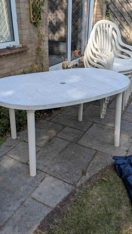 Photo of free Plastic garden table and chairs (Woking. St Johns) #2