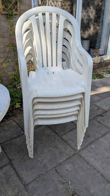 Photo of free Plastic garden table and chairs (Woking. St Johns) #1