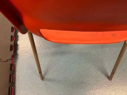 Photo of free 2 red plastic stacking chairs in a different design (Cheadle Hulme SK8) #3