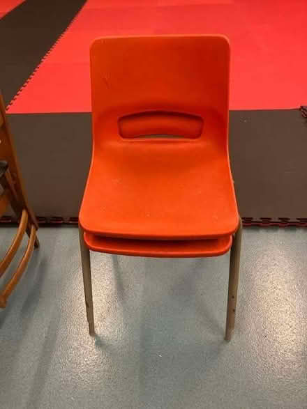Photo of free 2 red plastic stacking chairs in a different design (Cheadle Hulme SK8) #4