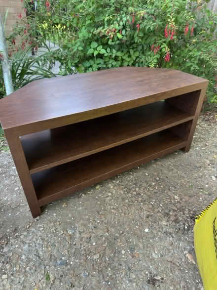 Photo of free Dark wood corner tv unit (Castle Point) #1