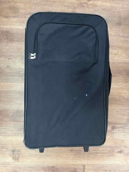 Photo of free Large black suitcase (Tooting SW17) #1