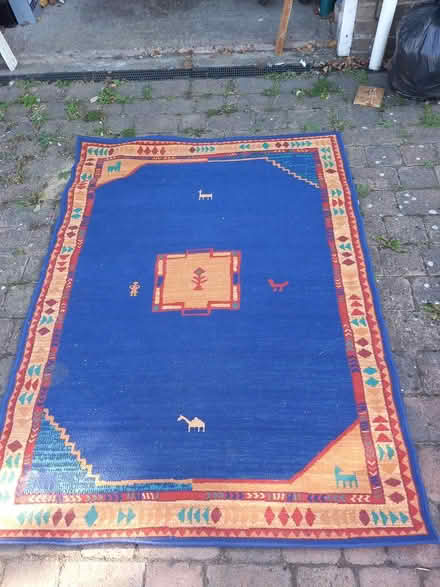 Photo of free Large blue rug 4ft X 6ft approx (CO4 Highwoods) #1