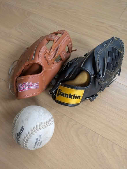 Photo of free Two Softball gloves and softball (KT15) #2