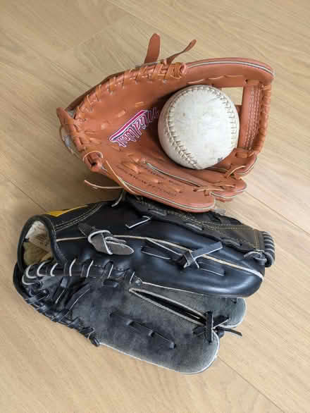Photo of free Two Softball gloves and softball (KT15) #1