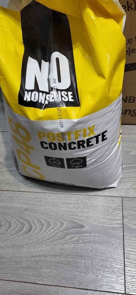 Photo of free Nearly full bag of post concrete. Piece of plaster board (Huyton Quarry L36) #1