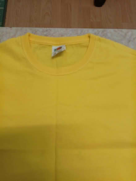 Photo of free Bright yellow T-shirt 12-13 years (Castlefield HP11) #1