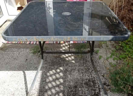 Photo of free Glass topped metal-rimmed garden table (Moorfields) #1