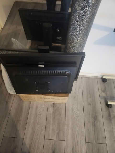 Photo of free Round glass table and 2 monitors (SE17) #2