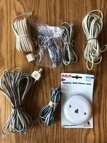 Photo of free landline phone cords of various lengths, wall jack, adapters [20886] #1