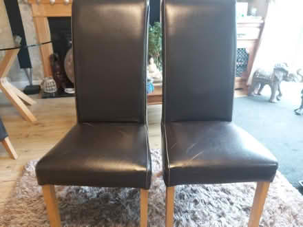 Photo of free 2×faux leather dining room chairs (Holtspur bucks) #1
