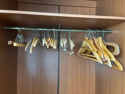 Photo of free Assorted wooden coat hangers (Hucclecote GL3) #1