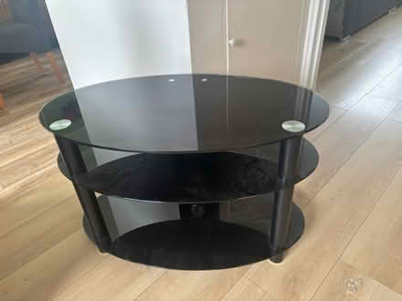 Photo of free Black glass tv stand (Stroud) #1
