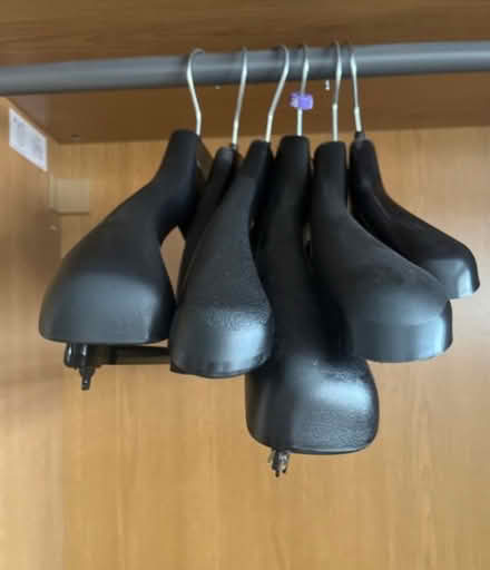 Photo of free 7x wide black plastic hangers (Newburgh WN8) #2