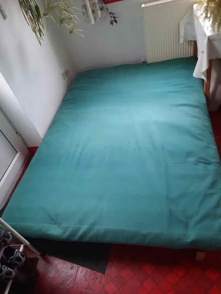 Photo of free Green cloth covered futon and base (Desford LE9) #1