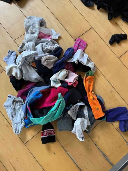 Photo of free Large quantity of odd socks and kids black ankle socks (Stroud GL5) #1