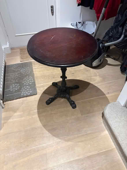 Photo of free Round side table dark wood. Metal stand. Heavy to carry. (Chiswick W4) #3