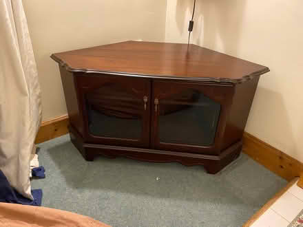 Photo of free Dark wood corner TV cabinet (Sutton in the Elms LE9) #1