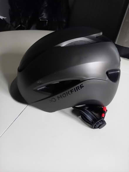 Photo of free Dark grey adult helmet (E8) #1