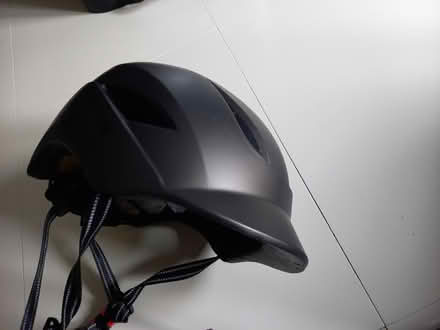Photo of free Dark grey adult helmet (E8) #2
