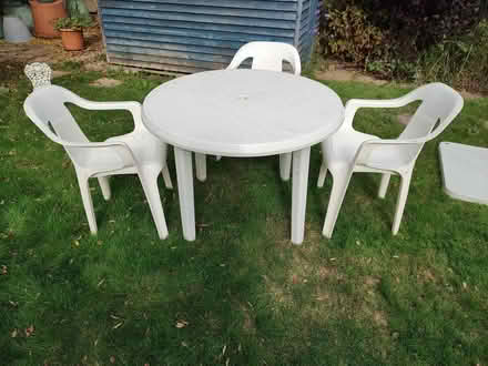 Photo of free White plastic patio table and 3 chairs (Sidley TN40) #2