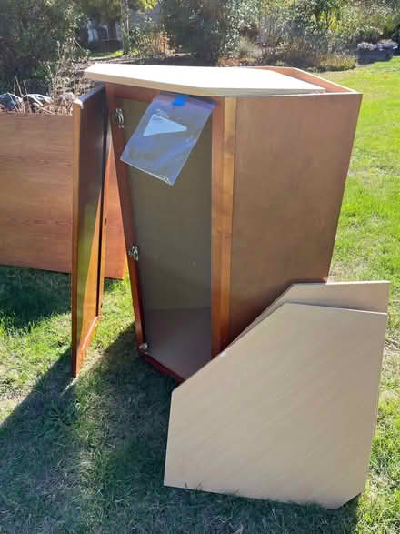 Photo of free Corner cabinet with three shelves (11980 SW Greenwood, Beaverton) #1