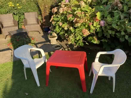 Photo of free red plastic table and 2 plastic chairs (Kendal LA9) #1