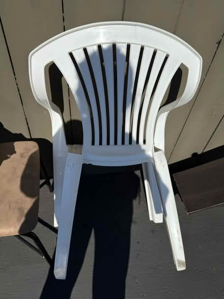 Photo of free White plastic chair with arm rests (Valencia Avenue, Sunnyvale) #2