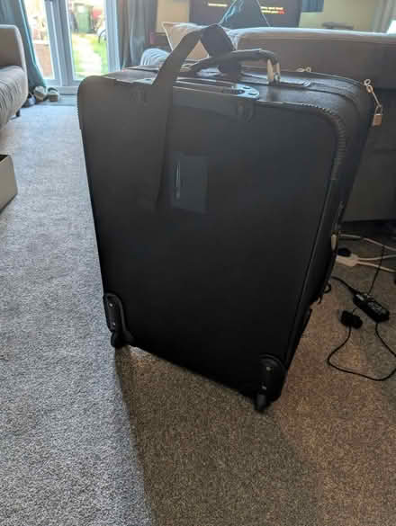Photo of free Large black carry on case (Yaxley, Peterborough) #2