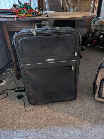 Photo of free Large black carry on case (Yaxley, Peterborough) #1