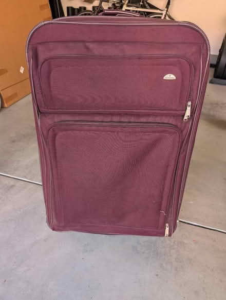 Photo of free Large burgundy suitcase (Terra Vista Way and Pierce Ave) #1