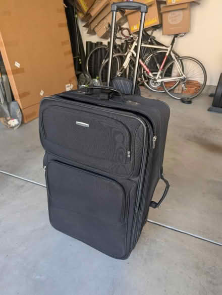 Photo of free Large black suitcase (Terra Vista Way and Pierce Ave) #1