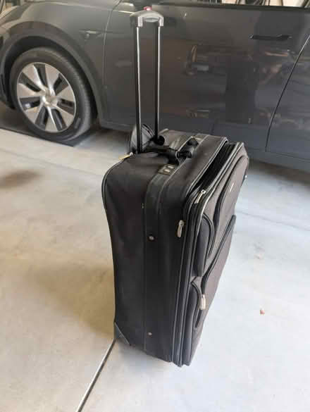 Photo of free Large black suitcase (Terra Vista Way and Pierce Ave) #2