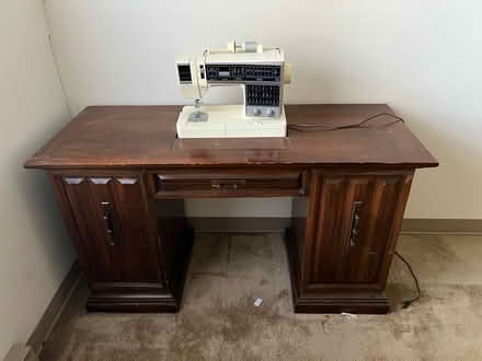 Photo of free Sewing cabinet with sewing machine (Walmart- garland groh blvd) #1