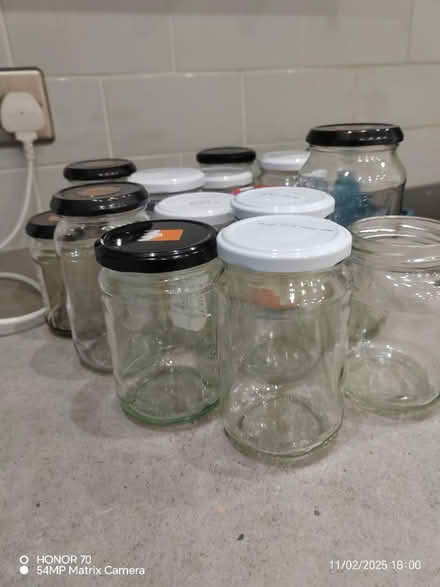 Photo of free 17 glass jars, one missing led (BD22) #2