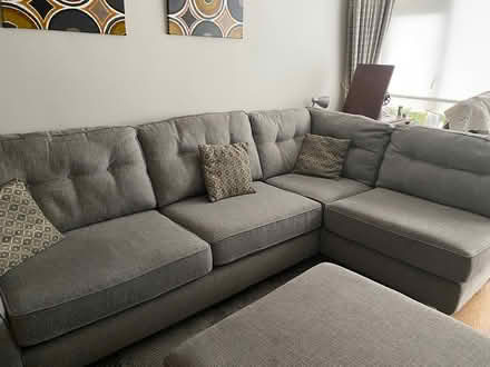 Photo of free Medium grey corner sofa with pouffe (Templeogue) #1