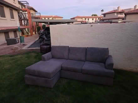 Photo of free Large gray sofa (wouldn't fit door) (Chazal apartments bldg 10) #1