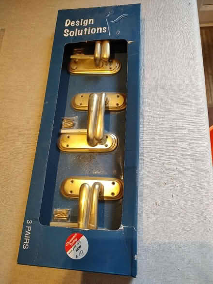 Photo of free 3 pairs of polished brass effect door handles (Tilekiln TN38) #1