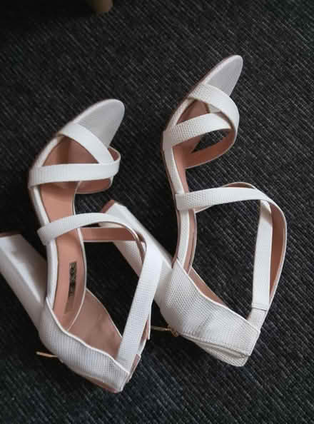 Photo of free Plastic hangers and white shoes (Battersea Sw11) #2