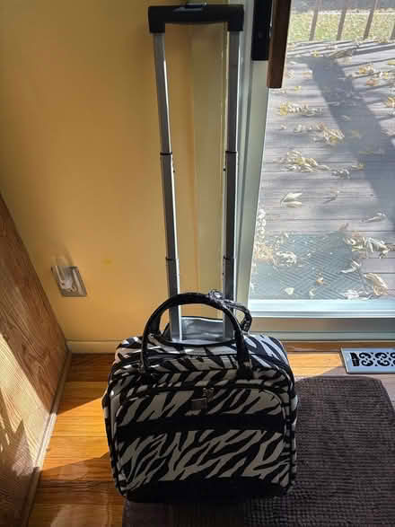 Photo of free Zebra striped rolling bag (S Garland St and W Yale Ave) #2