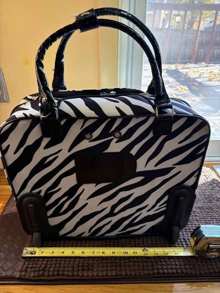 Photo of free Zebra striped rolling bag (S Garland St and W Yale Ave) #4