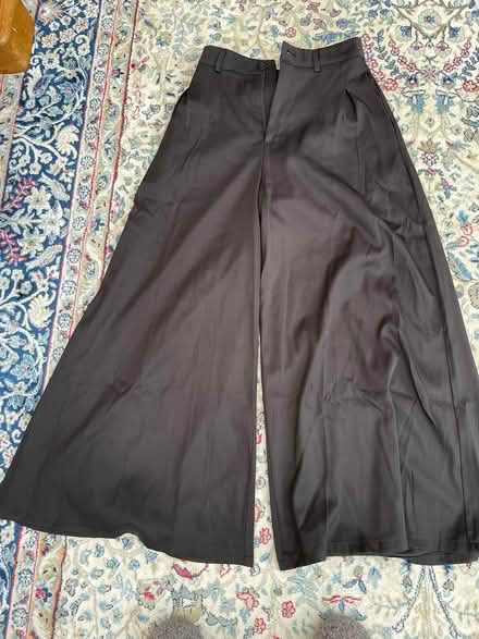 Photo of free Black baggy trousers (PE8) #1