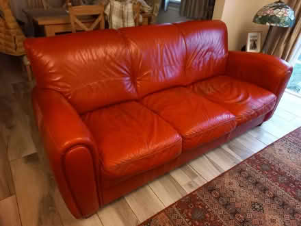 Photo of free Two Red Leather Sofas and matching Pouffe (Wallington PO16) #1
