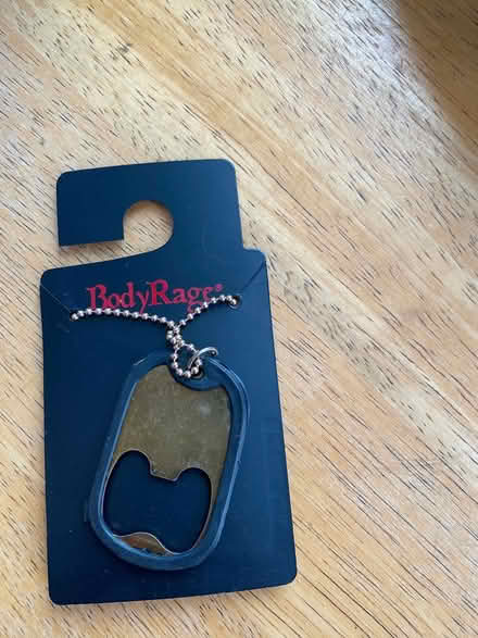 Photo of free Beer opener dog tag necklace (Lowell and highland) #1