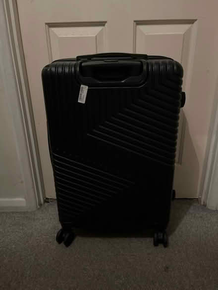 Photo of free Black luggage (OL8 2XQ) #1