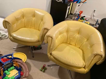Photo of free Pair of vinyl yellow swivel chairs (Fruitland, MD) #1