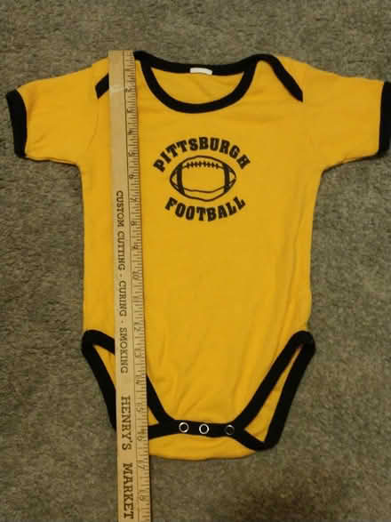 Photo of free Black and gold onesie (Harrisville) #1