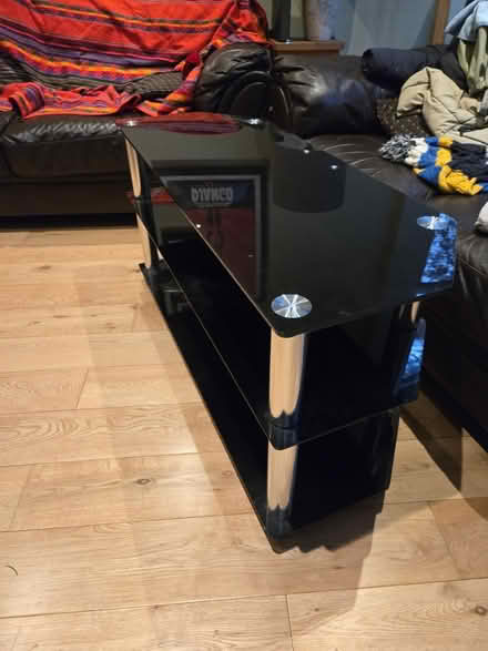 Photo of free Black glass TV stand (W4) #1