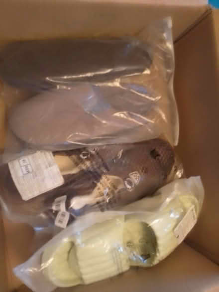Photo of free New slippers and sliders -- resale? (Biggleswade) #1