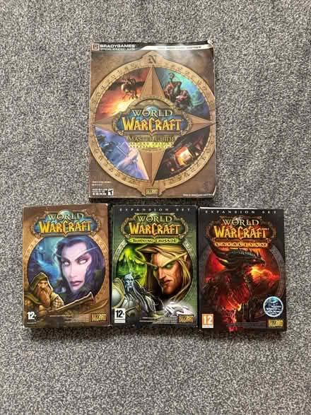 Photo of free War of Warcraft discs and books. (Lower Earley RG6) #1